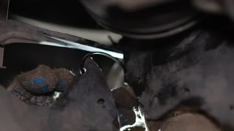 Mechanic Inspecting Rusty Suspension Control Arms Under Car Wheel Hub Stock Footage 345570490