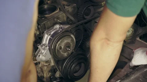 A mechanic inspects an old car engine Video stock 110862996