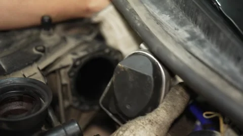 Mechanic installing air intake hose onto car throttle body assembly. Stock Footage 341486673