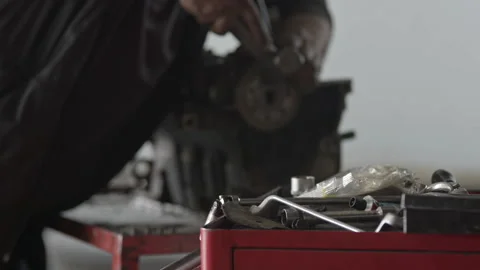 Mechanic Installing Crankshaft With Tools In Foreground Stock Footage 339372750