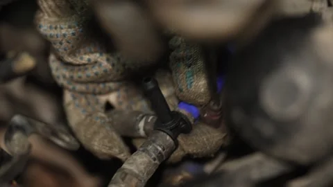 Mechanic installing plastic vacuum hose connector inside car engine bay. Stock Footage 341486695