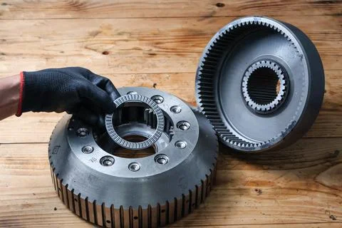 Mechanic Installing Thrust Needle Bearing into Planetary Carrier. Stock Photos