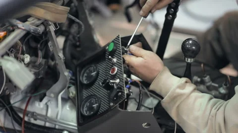Mechanic installs additional dashboard Stock Footage