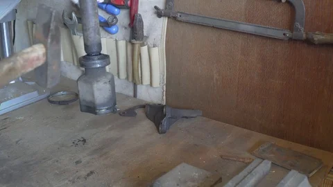 The mechanic knocks tripod from the drive shaft of the vehicle Video stock 107008142