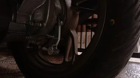 Mechanic looking for a tire problem Stock Footage 242822360