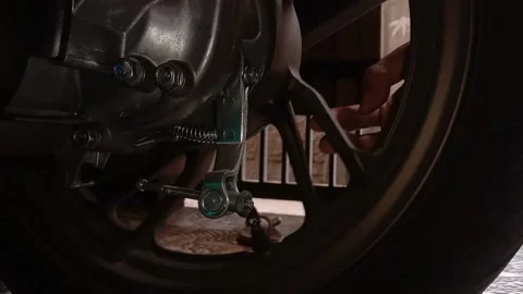 Mechanic looking for a tire problem Stock Footage 242974448