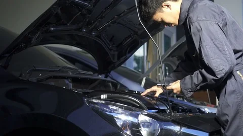 Mechanic man checking, working at workshop car service. Stock Footage 81013841
