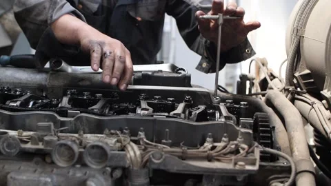 Mechanic man fixing truck engine with tools in professional service center. Video stock 313815227