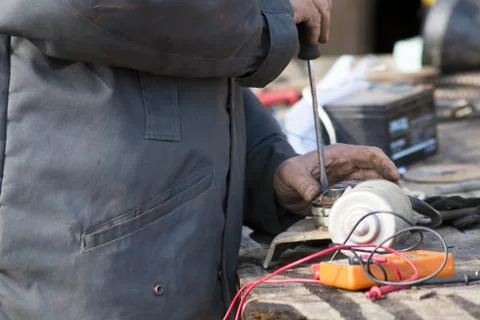 Mechanic man worker with socket wrench during car repair works in auto serv.. Stock Photos