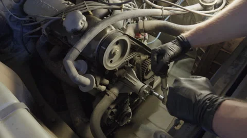 Mechanic Manually Turning Old Engine With Ratchet Wrench Stock Footage 342995380