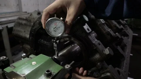 Mechanic measures the inner surface of the engine block with a micrometer Stock Footage 75250787