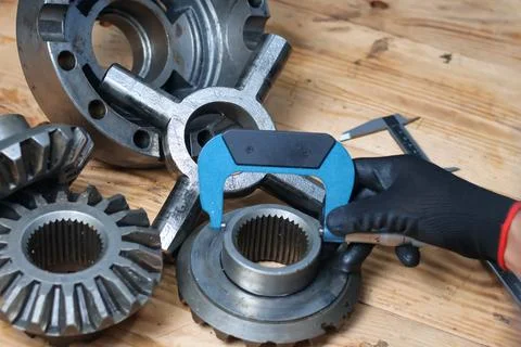 Mechanic Measuring Differential Side Gear Hub Diameter Using Outside Microm.. Stock Photos