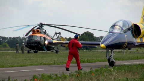 Mechanic meets L-39 training aircraft of Baltic Bees group after landing. Stock Footage 121247115