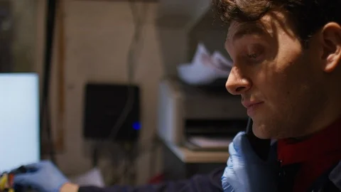 Mechanic in the office taking notes over the phone Stock Footage 102538263