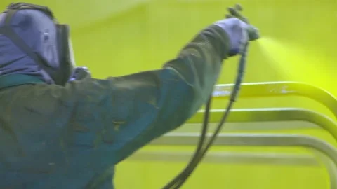 Mechanic Paints Car Using Industrial Paint Sprayer Pistol in Yellow, OTS Stock Footage 136715461