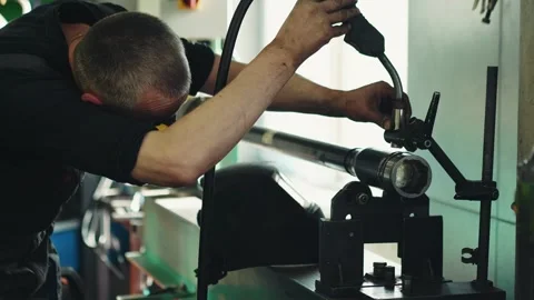 Mechanic performs maintenance and welding work of a propeller shaft in a car Stock Footage 281581665