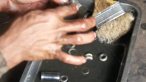 A mechanic performs repairs, maintenance and cleaning on a motorbike CVT Stock Footage 312517578