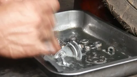 A mechanic performs repairs, maintenance and cleaning on a motorbike CVT Stock Footage 312517580