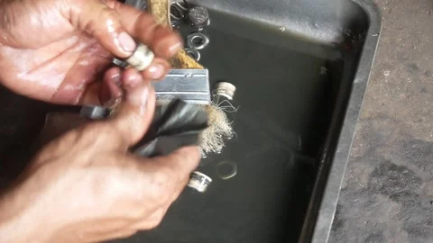 A mechanic performs repairs, maintenance and cleaning on a motorbike CVT Stock Footage 312517597