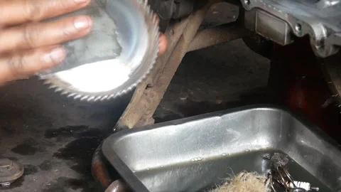 A mechanic performs repairs, maintenance and cleaning on a motorbike CVT Stock Footage 312517655