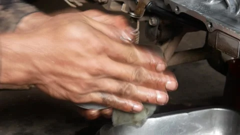 A mechanic performs repairs, maintenance and cleaning on a motorbike CVT Stock Footage 312517688