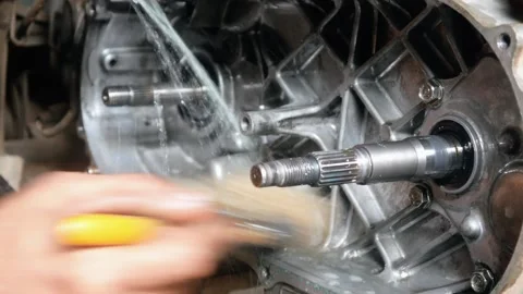 A mechanic performs repairs, maintenance and cleaning on a motorbike CVT Stock Footage 312517750