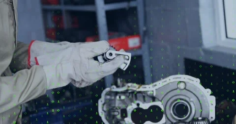 Mechanic picking up part, rotating and checking gear fit for repair on bench Stock Footage 329930186