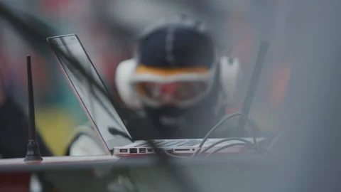 Mechanic at Pitstop at Car Racing - Racing Engineer at Auto Race - Slow Motion Stock Footage 146197484