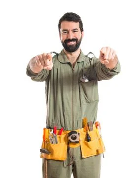 Mechanic pointing to the front Stock Photos