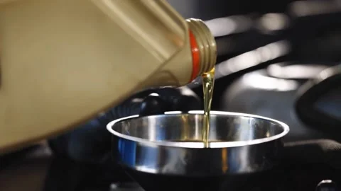 Mechanic Pouring Oil into Engine Stock Footage 315145077
