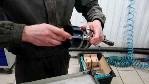 The mechanic prepares the engine pistons for installation 1 Stock Footage 150266731