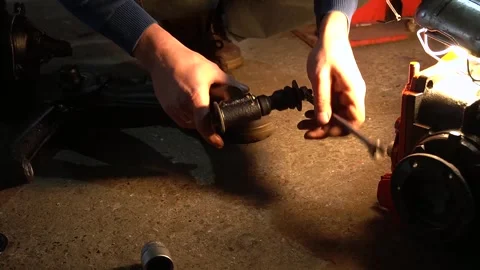 Mechanic pressing new silent blocks into the rear suspension Видео 297687324