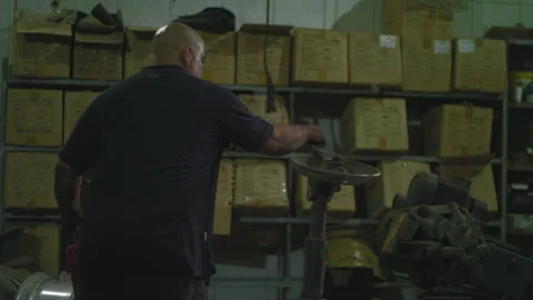 Mechanic pulls a machine towards himself Stock Footage 275073958