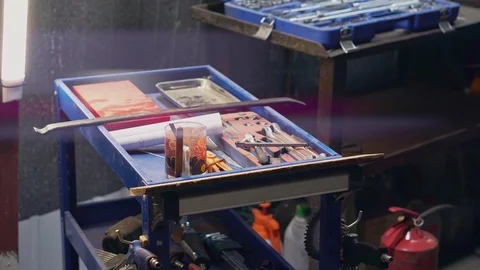 The mechanic puts the keys in the set with the working tools Stock Footage 104015401