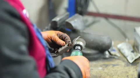 Mechanic Removing Rust from Brake Component with Wire Brush Tool Stock Footage 331704224