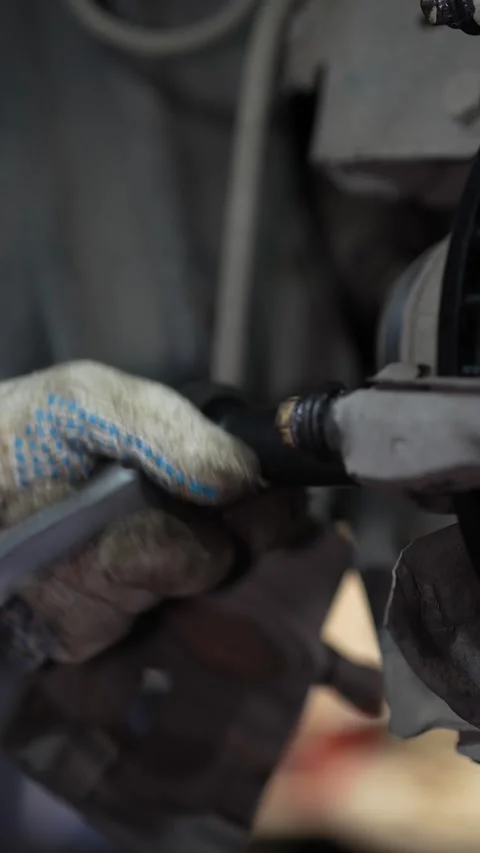 Mechanic Removing Rusty Brake Disc from Car Wheel Hub Stock Footage 345566430