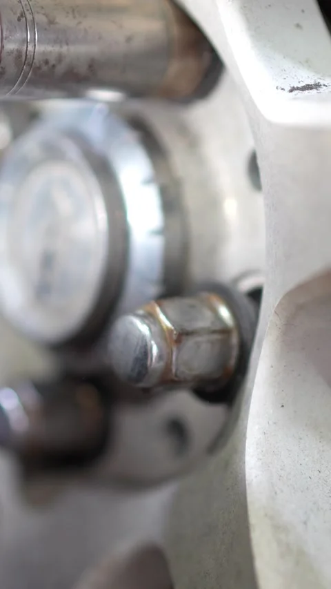 Mechanic Removing Rusty Brake Disc from Car Wheel Hub Stock Footage 345570302