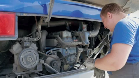Mechanic repairing a bus engine Stock Footage 277109871