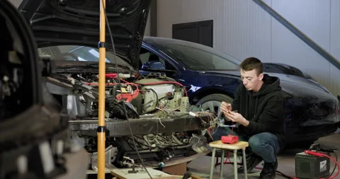 Mechanic Repairing Car Engine In Auto Service Center Stock Footage 277338286