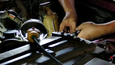 Mechanic repairing engine car. Stock Footage 73750602