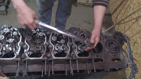 Mechanic repairs a big truck engine Stock Footage 105281353