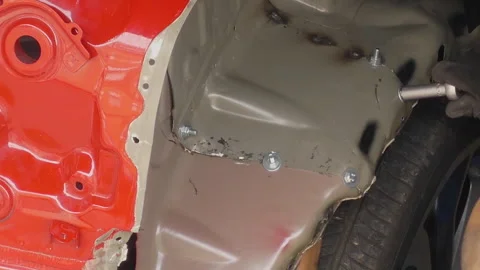 Mechanic Repairs Car Wheel Panel With His Skilled Hands Stock Footage 278571559