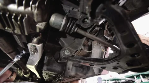 Mechanic repairs chassis Stock Footage 42580544