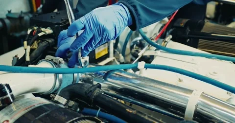 Mechanic Repairs Engine in Workshop Setting Stock Footage 323765555