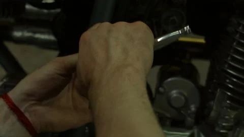 Mechanic repairs motorcycle Stock Footage 147554257
