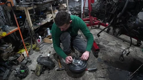 Mechanic repairs the vacuum Stock Footage 235676781
