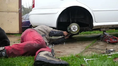 The Mechanic Repairs The White Car Stock Footage 42704221