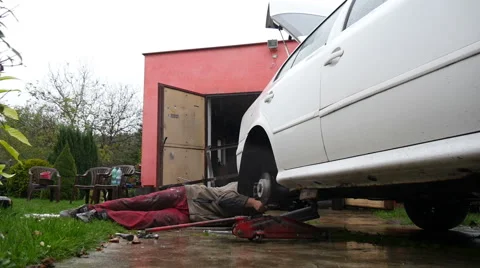 The Mechanic Repairs The White Car Stock Footage 42704402