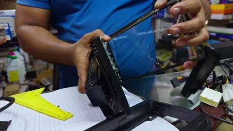 Mechanic replace broken screen folder of car android CD Stock Footage 299785936