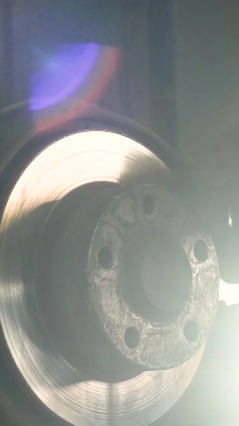 Mechanic replacing brake disc and pads on car in garage Stock Footage 332858393